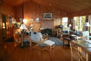 Upstairs Living Room in the Main Cabin. Indoor dining table off to the right.