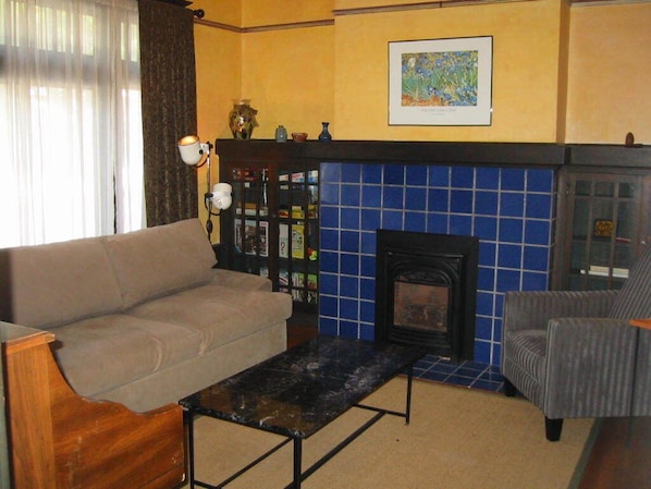 Den with sleeper sofa and gas fireplace
