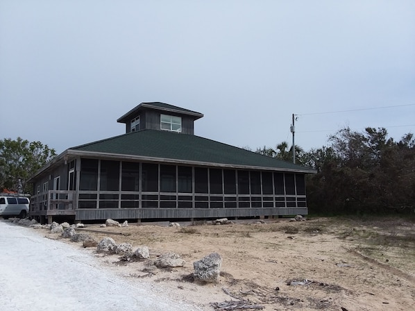 Front of house with screen porch