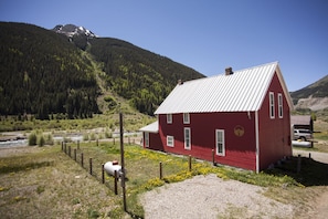 Exterior of house looking toward the river with Kendall Mountain. 