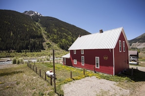 Exterior of house looking toward the river with Kendall Mountain.