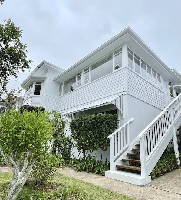 Jetty Beach House painted white December 2023 🤍