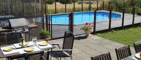 pool ,patio and view across the valley