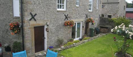 Loft entrance, patio area and garden