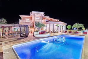 Villa & pool by night. The pool is heated to 29c all year round.
