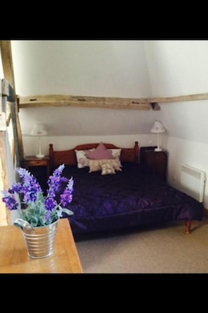 The main bedroom which has the bakery chimney as a feature
