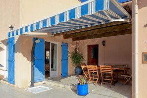 Shaded patio for alfresco dining.