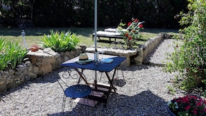 Sunny terrace with essential parasols for shade. Good reads highly recommended.