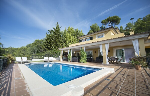 View of the house with the porch and pool