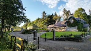 Rental entrance on left, garden and driveway