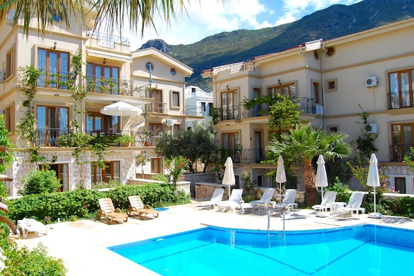 Communal pool in front of Zakkum Apartment, (on first floor with sun parasol)