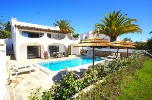 Terrace with swimming pool in front of the villa 