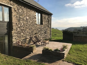 Garden terrace with view to the sea for afternoon sun