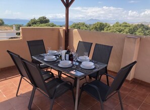 Dine alfresco under the pergola on our solarium