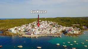 Our house position within the beautiful bay and village of Es Grau.