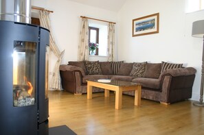 Lounge with wood burning stove.