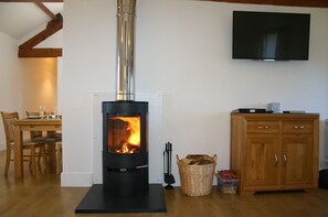 Cosy wood burning stove & HD smart TV.