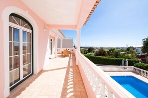 Balcony overlooking the swimming pool, with views to the coast.