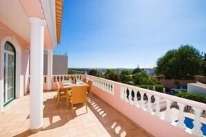 Balcony overlooking the swimming pool, with views to the coast.