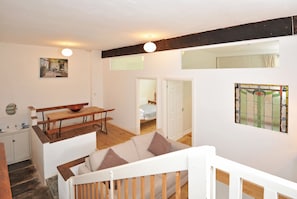 A downstairs livingarea has space for a game of table football or quiet reading.