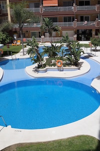 Los Boliches, Luxury Beach Front Apartment. Overlooks the stunning pool & garden