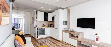 MAIN LIVING ROOM WITH OPEN KITCHEN CONCEPT. LOTS OF LIGHT AND WONDERFUL VIEWS