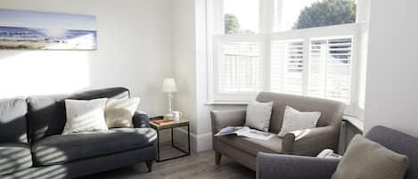 Bright, airy Sitting room with shutters