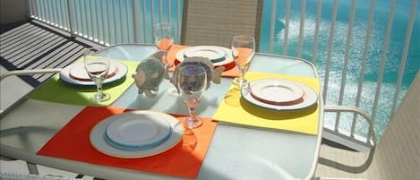 Have your breakfast at this table with festive dinnerware overlooking gulf