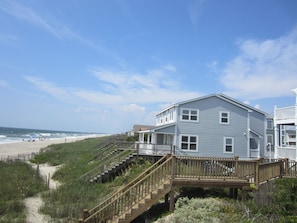 House sits closer to the water with unobstructed views up and down the beach.