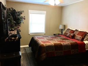 Master Bedroom Suite with a Queen Size Bed and Connecting Bathroom