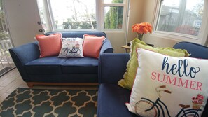 Sofa & Love Seat in living room, with coastal breezes and natural light. 