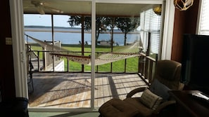 Open the doors and relax on the hammock on the screened porch