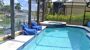 View of pool and canal from loungers. It really doesn't get much better!!