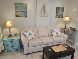 Comfy sofa in living/dining area; also a pull out queen size bed; great for kids