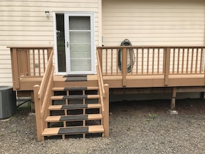 Six steps to the back door for the upper level of the house.