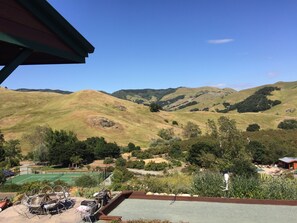 View from the mid deck overlooking bocci ball court tennis court and pool