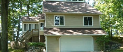 front of home with 2 car garage + additional parking