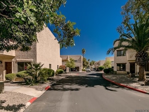 
Condo on right corner by Large Palm