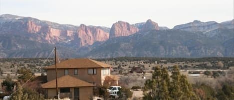 View of the house from across our property with Kolob Canyon in the background.