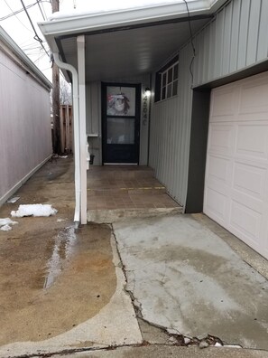 Front porch & parking spot just in front of door, off street in secured lot