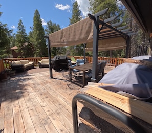 Enjoy summer outdoor living on a large deck with dining for 10 & mountain views!