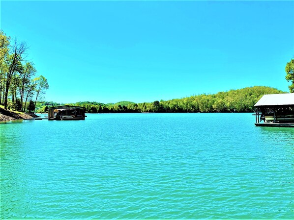 Safe swimming cove protected from the main lake view from covered dock in summer