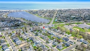 A beautiful view of the lake from the porch. Bike, walk or drive to the beach.