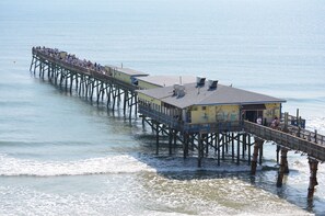 Sunglow Pier with Crabby Joe&apos;s restaurant