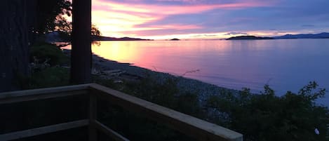 View spectacular sunsets from the deck of the comfort of the living room sofa!