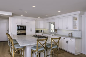 Kitchen with Wolf/Subzero appliances and ice machine.