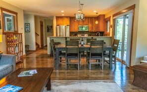 Dining table with seating for 6.  Breakfast bar with 3 barstools.  