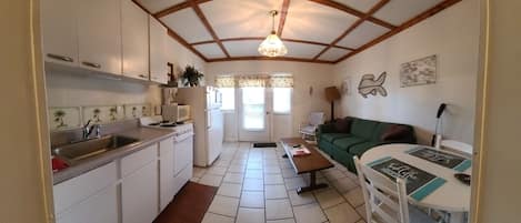 Panoramic view of living room & kitchen from bedroom