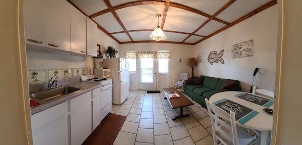 Panoramic view of living room & kitchen from bedroom