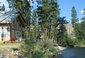 The house is 16 feet from the riverbank. Deck is 18 inches from the riverbank.